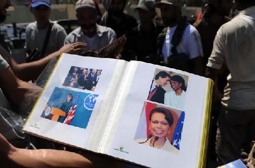 >卡扎菲女保镖死的图像 利比亚卡扎菲女儿相片